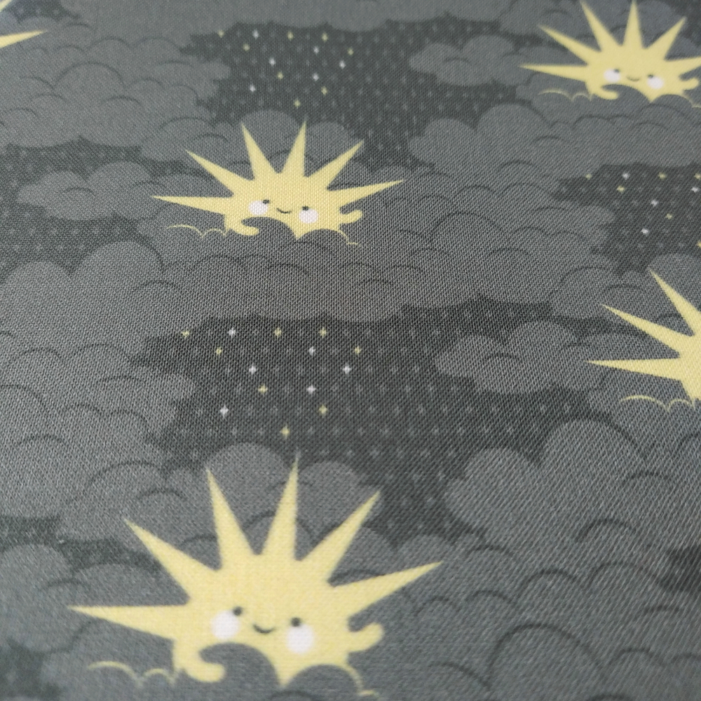 Happy sun in a sea of gray clouds fabric